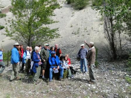 Geology tour group under leadership of Murray Roed on big GREEN comfy couch